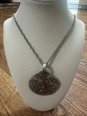 Vintage-Inspired Silver Pendant Necklace for Women with earrings and feather